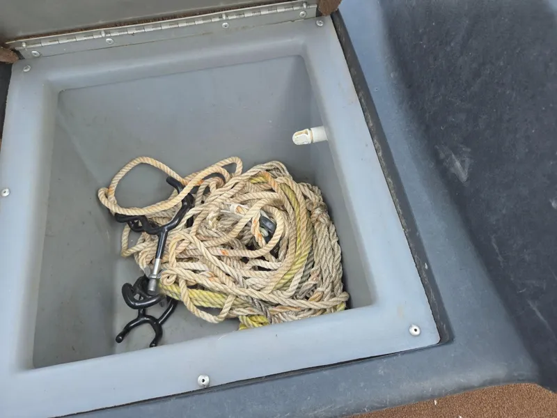 Slide: The Image of Storage compartment with rope in 2018 Tracker Bass Tracker 40th Anniversary Heritage Edition boat. - 19