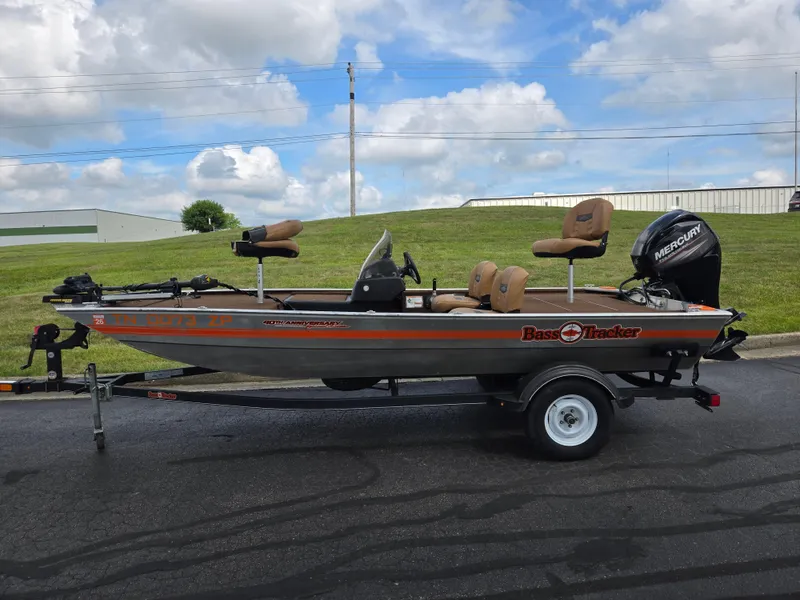 Slide: The Image of 2018 Tracker Bass Tracker 40th Anniversary Heritage Edition boat on trailer, outdoors. - 4