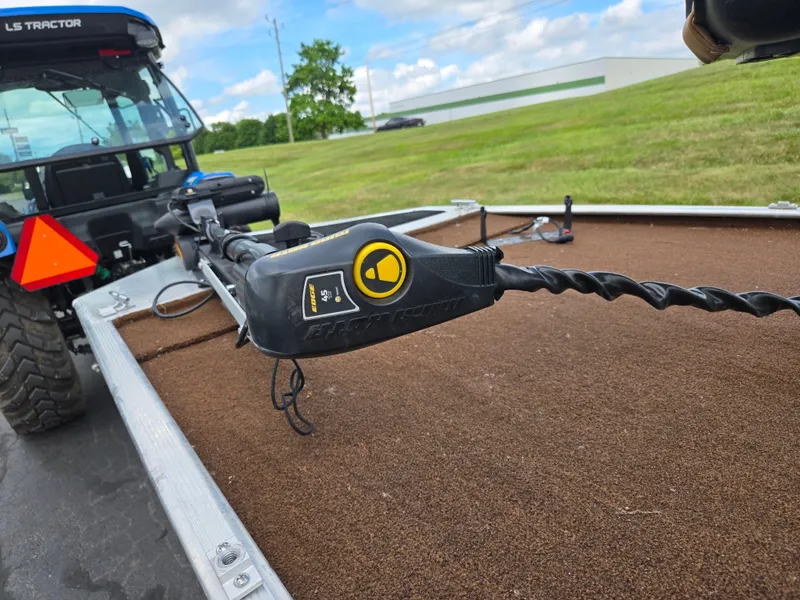 Slide: The Image of 2018 Tracker Bass Tracker 40th Anniversary Heritage Edition on trailer, with tractor in background. - 5