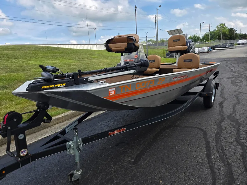 Slide: The Image of 2018 Tracker Bass Tracker 40th Anniversary Heritage Edition boat on trailer, parked outdoors. - 6