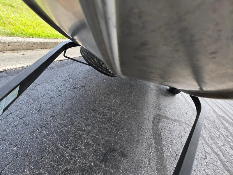 Slide: The Image of Underneath view of a 2018 Tracker Bass Tracker 40th Anniversary Heritage Edition boat on a trailer. - 8