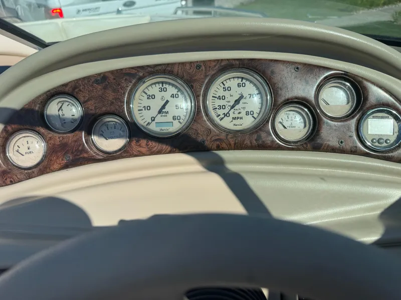 Slide: The Image of Dashboard of a 1999 Caravelle 209 Bow Rider boat with gauges and controls. - 14