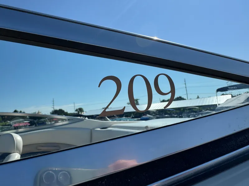 Slide: The Image of 1999 Caravelle 209 Bow Rider boat with clear blue sky background. - 15