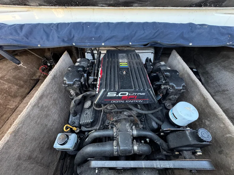 Slide: The Image of 1999 Caravelle 209 Bow Rider engine compartment with 5.0 liter EFI digital ignition. - 16