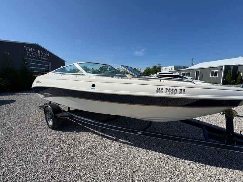 Slide: The Image of 1999 Caravelle 209 Bow Rider boat on trailer at Elk Rapids Marina. - 6
