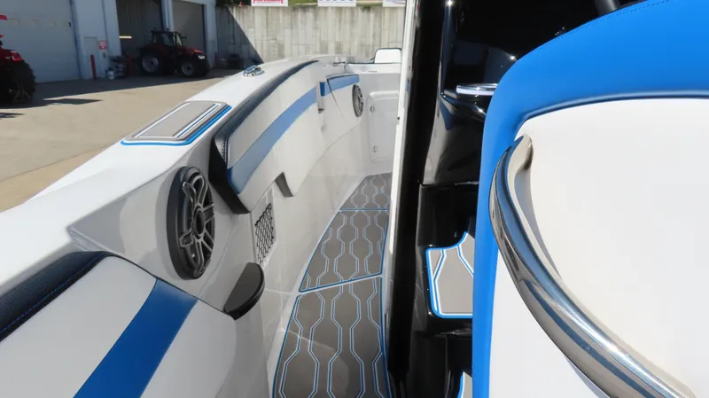 Slide: The Image of 2023 Sunsation 32 CCX boat interior with blue accents and modern design. - 12