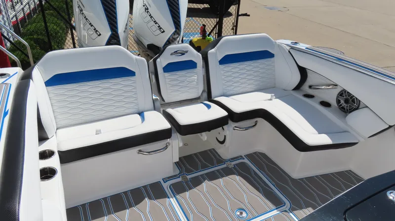 Slide: The Image of 2023 Sunsation 32 CCX boat interior with white and blue seating, stylish design. - 15