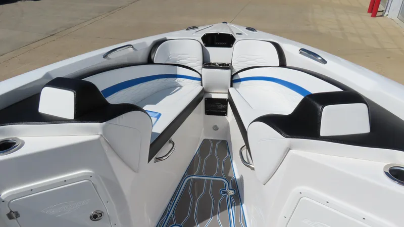 Slide: The Image of 2023 Sunsation 32 CCX boat interior with white and blue seating, modern design. - 17