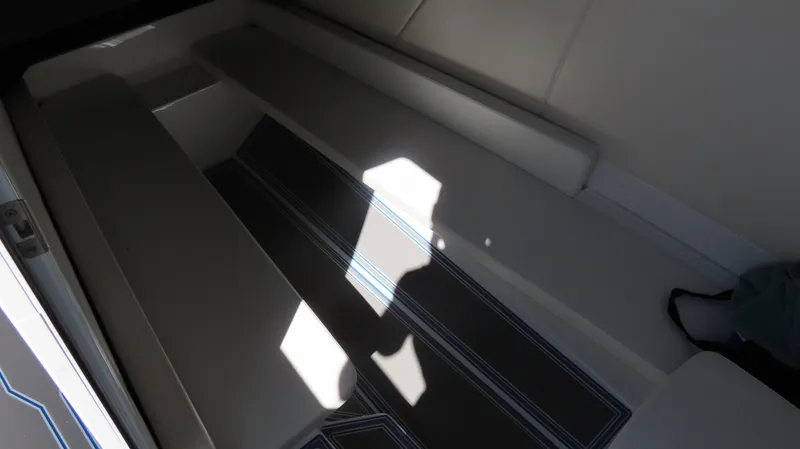 Slide: The Image of Interior seating of 2023 Sunsation 32 CCX boat with shadow and light contrast. - 19