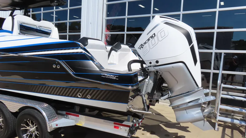 Slide: The Image of 2023 Sunsation 32 CCX boat with powerful outboard engine on a trailer. - 2