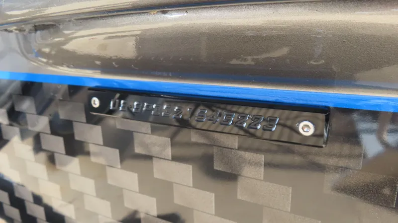 Slide: The Image of 2023 Sunsation 32 CCX boat hull identification number on carbon fiber finish. - 20