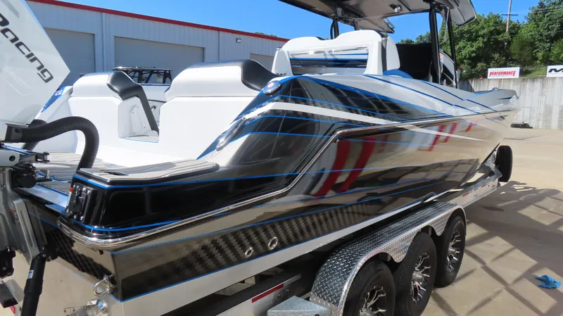 Slide: The Image of 2023 Sunsation 32 CCX boat on trailer, sleek design with modern detailing. - 6