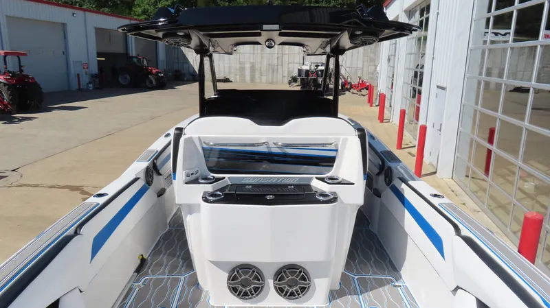 Slide: The Image of 2023 Sunsation 32 CCX boat interior with modern design and blue accents. - 8