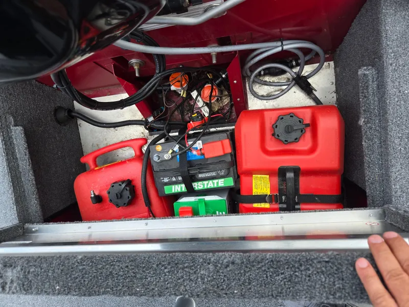 Slide: The Image of 2024 Tracker Bass Tracker Classic XL boat storage with battery and fuel tanks. - 20