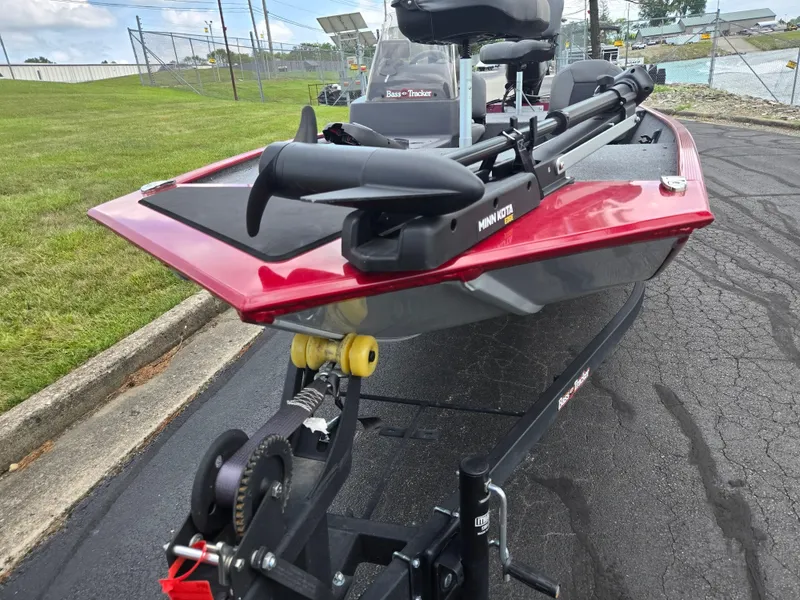 Slide: The Image of 2024 Tracker Bass Tracker Classic XL boat on trailer, featuring Minn Kota trolling motor. - 7