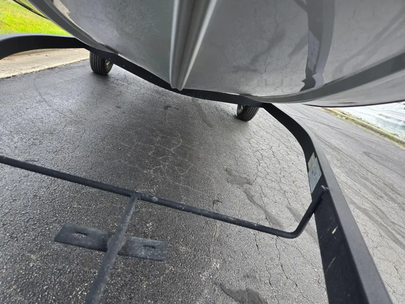 Slide: The Image of 2024 Tracker Bass Tracker Classic XL on trailer, close-up view of hull and wheels. - 8