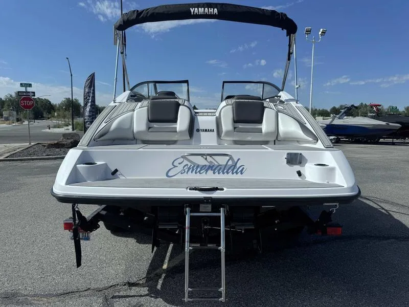 Slide: The Image of 2022 Yamaha SX210 boat named Esmeralda, rear view with ladder and seating. - 8