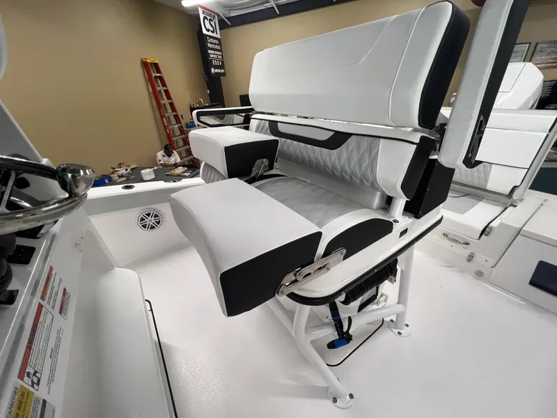 Slide: The Image of 2026 Blackfin 242 HB boat interior with white and black seating, showcasing modern design. - 16