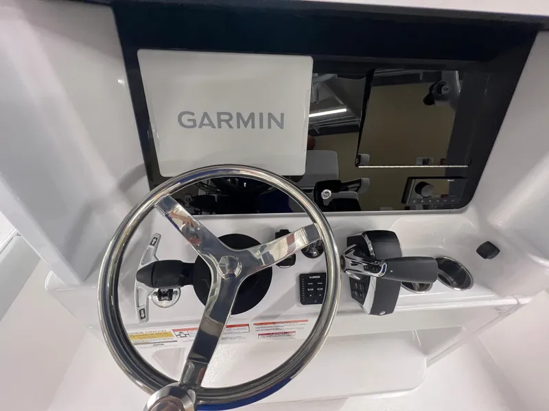 Slide: The Image of Steering console of 2026 Blackfin 242 HB boat with Garmin navigation system. - 17