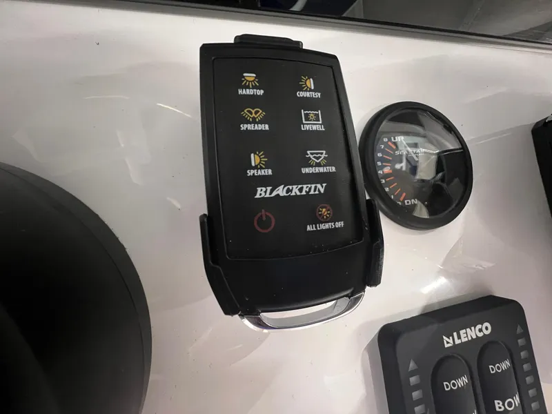 Slide: The Image of Control panel of 2026 Blackfin 242 HB boat with various function buttons. - 18