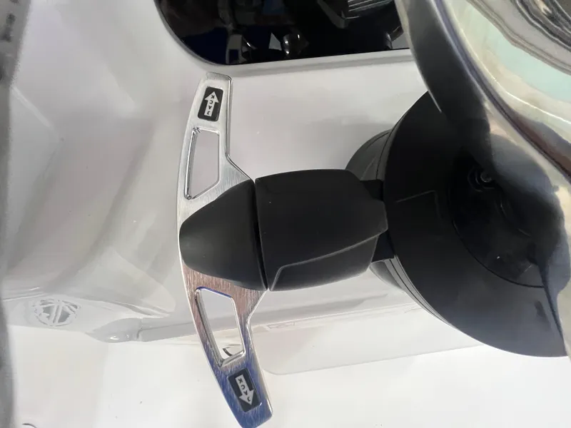 Slide: The Image of Steering wheel of 2026 Blackfin 242 HB boat, featuring modern controls and sleek design. - 19