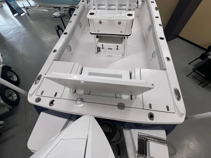 Slide: The Image of 2026 Blackfin 242 HB boat interior, showcasing seating and storage compartments. - 5