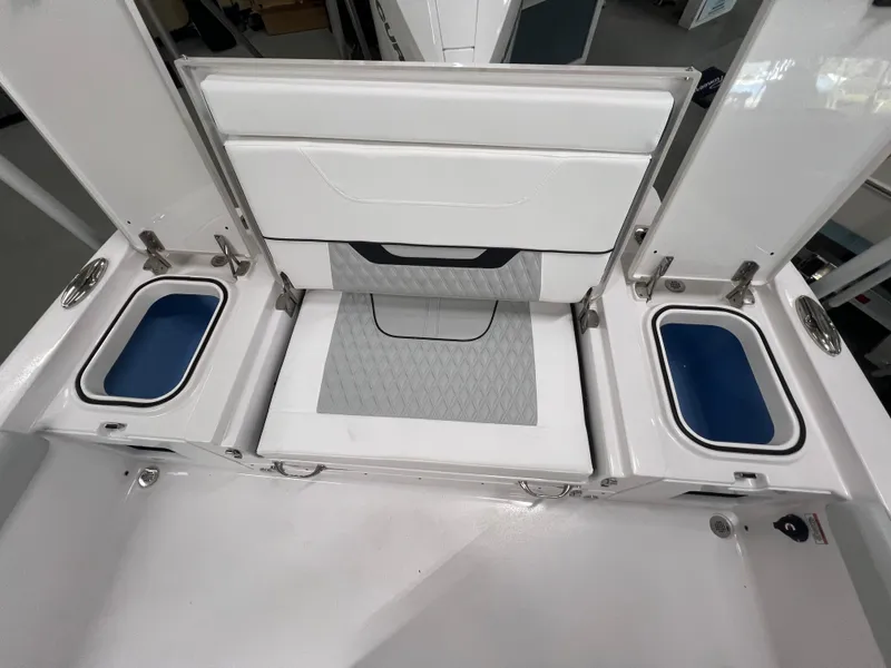 Slide: The Image of 2026 Blackfin 242 HB boat seating with storage compartments and sleek design. - 8