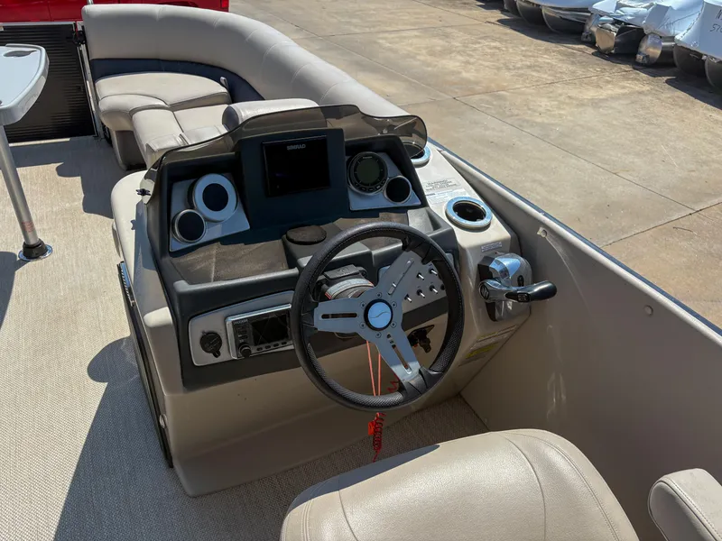 Slide: The Image of Interior of 2018 Silver Wave 250 Grand Costa CL pontoon boat with steering console. - 11
