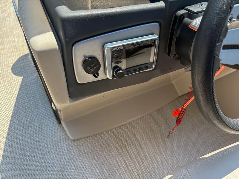 Slide: The Image of 2018 Silver Wave 250 Grand Costa CL dashboard with Kicker media center and steering wheel. - 13