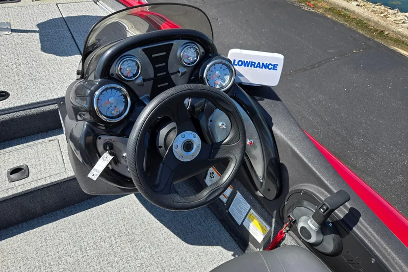 Slide: The Image of 2024 Tracker Pro Team 175 TXW boat dashboard with steering wheel and Lowrance display. - 12