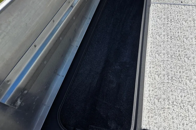 Slide: The Image of 2024 Tracker Pro Team 175 TXW boat interior storage compartment. - 15