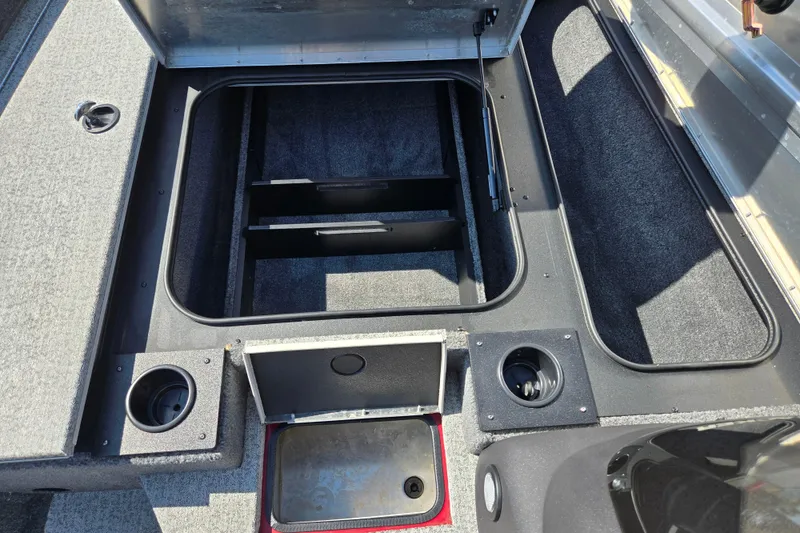 Slide: The Image of 2024 Tracker Pro Team 175 TXW boat interior storage compartments and cup holders. - 16