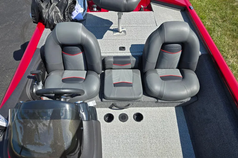 Slide: The Image of 2024 Tracker Pro Team 175 TXW boat interior with gray seating and red accents. - 21