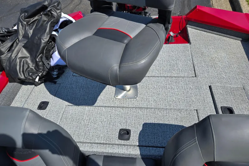 Slide: The Image of 2024 Tracker Pro Team 175 TXW boat interior with gray seating and carpeted deck. - 24