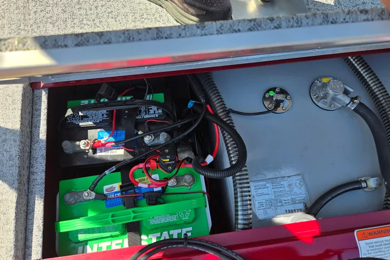 Slide: The Image of 2024 Tracker Pro Team 175 TXW battery compartment with wiring and components. - 25