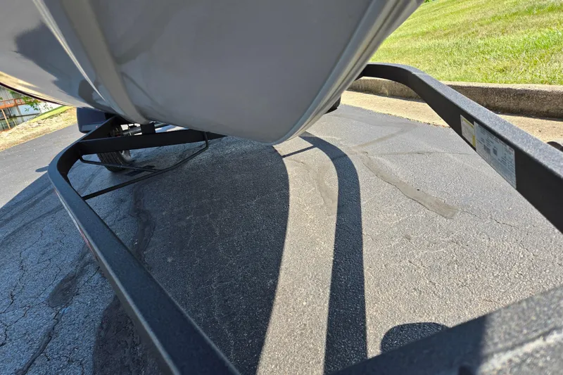 Slide: The Image of 2024 Tracker Pro Team 175 TXW boat on trailer, parked on asphalt. - 7