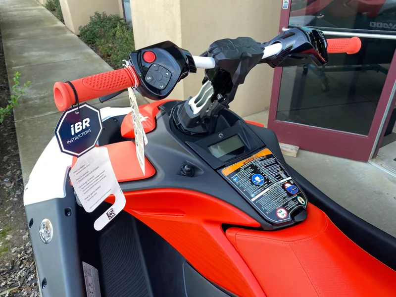 Slide: The Image of 2024 Sea-Doo Spark Trixx watercraft with red handlebars and iBR instructions tag. - 3