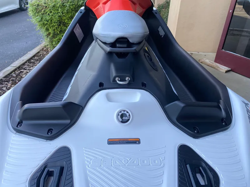 Slide: The Image of 2024 Sea-Doo Spark Trixx for 1, white and orange, close-up view of seat and controls. - 8