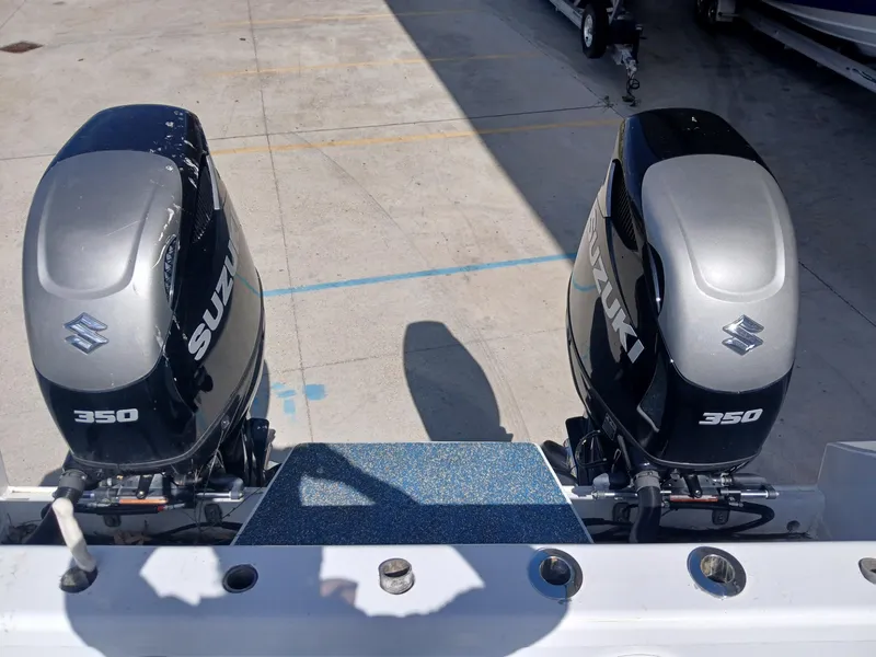 Slide: The Image of Twin Suzuki 350 outboard motors on a 2023 Razor Cat 37 Cat boat. - 13