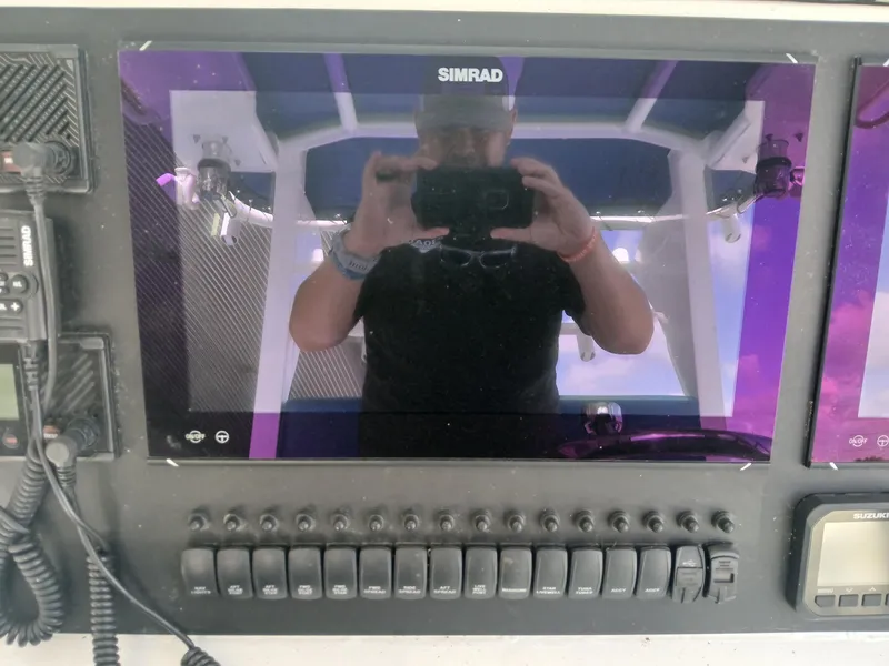 Slide: The Image of Control panel of Razor Cat 37 Cat 2023 with Simrad display and switches. - 15