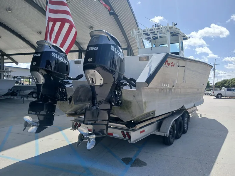 Slide: The Image of 2023 Razor Cat 37 Cat boat with dual Suzuki engines on a trailer. - 27