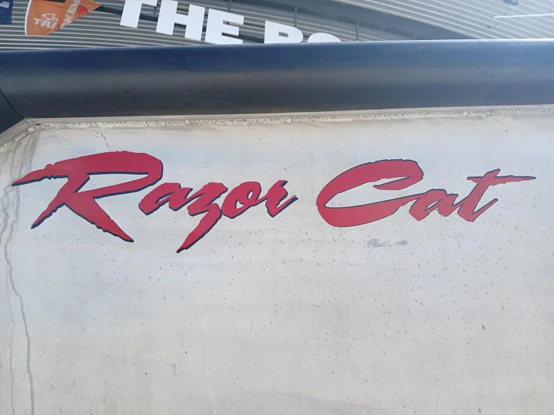 Slide: The Image of "Razor Cat" logo on a 2023 Razor Cat 37 Cat boat exterior. - 28