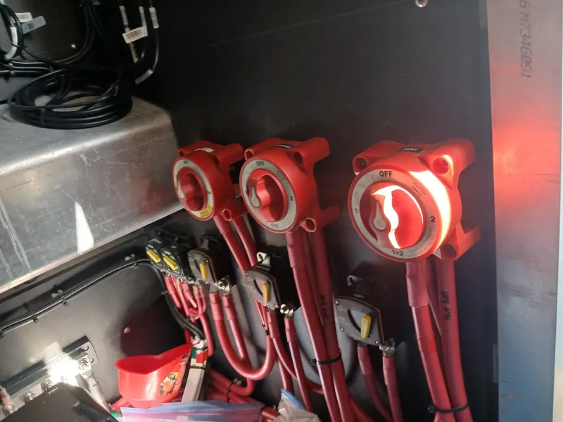 Slide: The Image of Electrical panel with red switches and cables in a 2023 Razor Cat 37 Cat. - 6