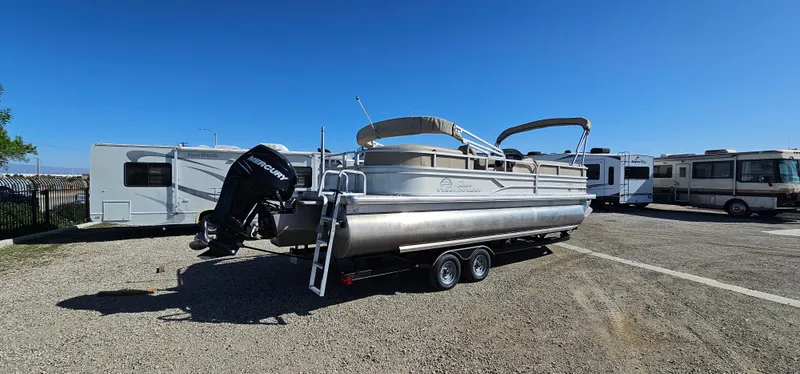 Slide: The Image of 2017 Sun Tracker Party Barge 240 pontoon boat with Mercury engine in a parking lot. - 3