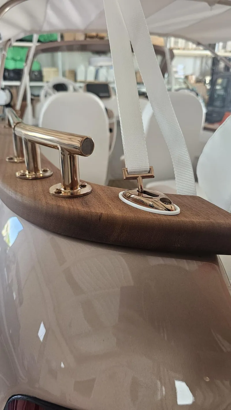 Slide: The Image of 2026 Car Off-shore Fiat 500 Rose Gold interior with elegant wood and metal accents. - 12