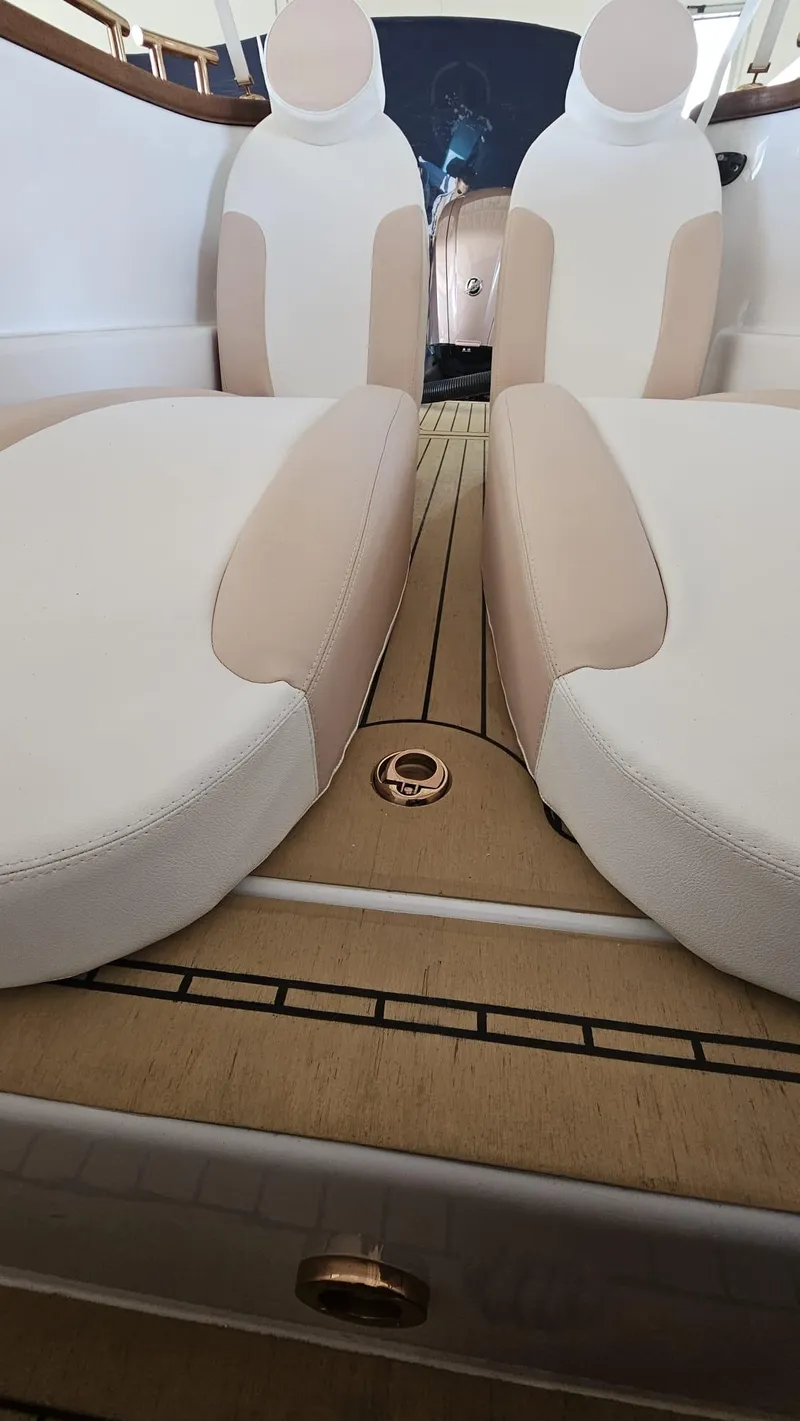 Slide: The Image of Luxurious interior of 2026 Car Off-shore Fiat 500 Rose Gold with beige seating. - 16