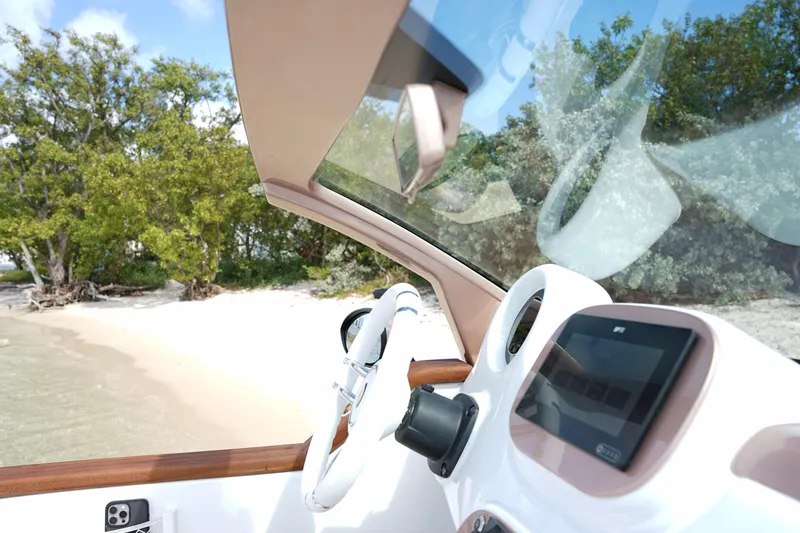 Slide: The Image of Interior view of 2026 Car Off-shore Fiat 500 Rose Gold near a sandy beach. - 21