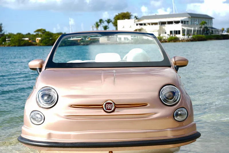 Slide: The Image of 2026 Fiat 500 Rose Gold floating on water, showcasing unique off-shore design. - 26