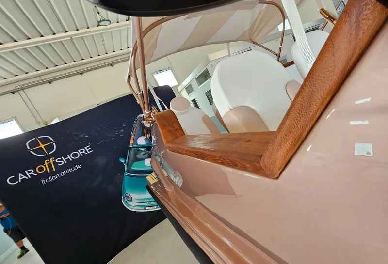 Slide: The Image of 2026 Car Off-shore Fiat 500 Rose Gold interior with elegant wood and metal accents. - 14