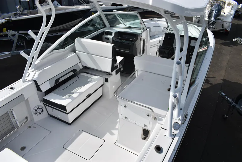 Slide: The Image of 2025 Blackfin 272 DC boat interior with white seating and modern dashboard. - 10
